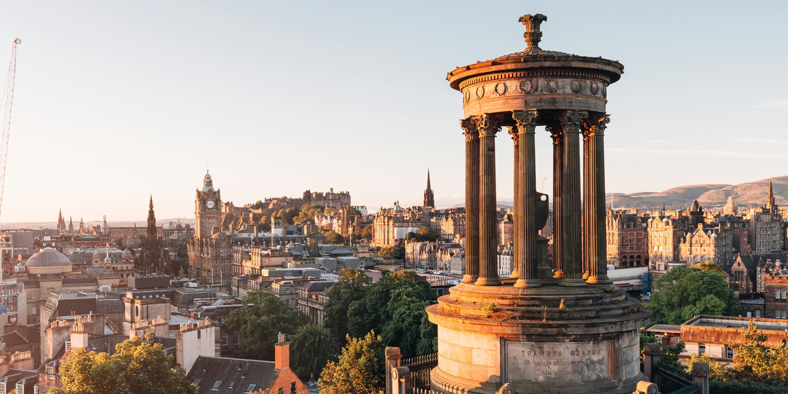 Edinburgh skyline with the Dugald Stewart Monument, Edinburgh Castle and residential buildings
